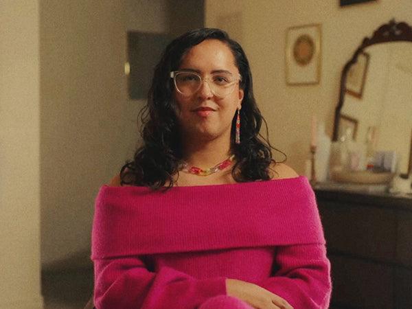 Zakary sits facing the camera