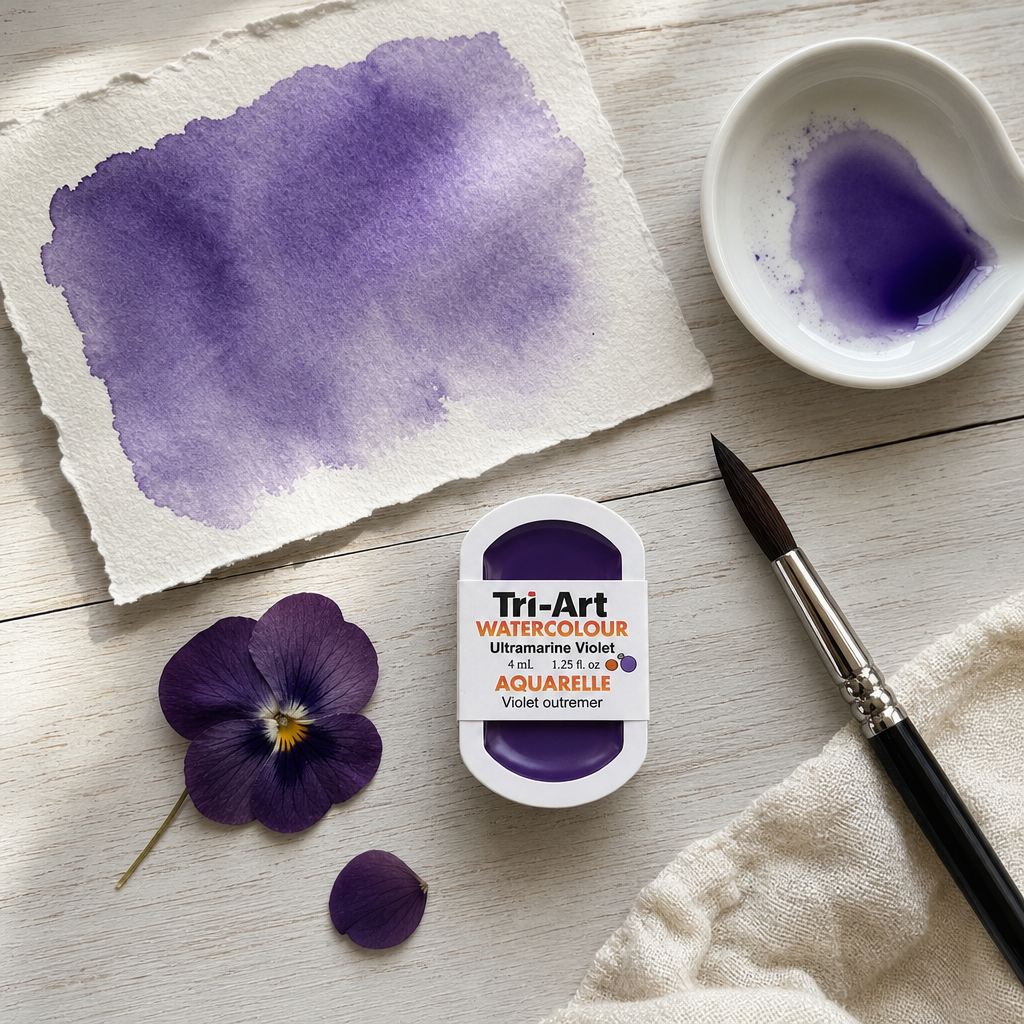 Tri-Art Watercolour pan Ultra Violet RS transparent PV 15 Series 2 styled flat lay with violet swatch and pressed pansy