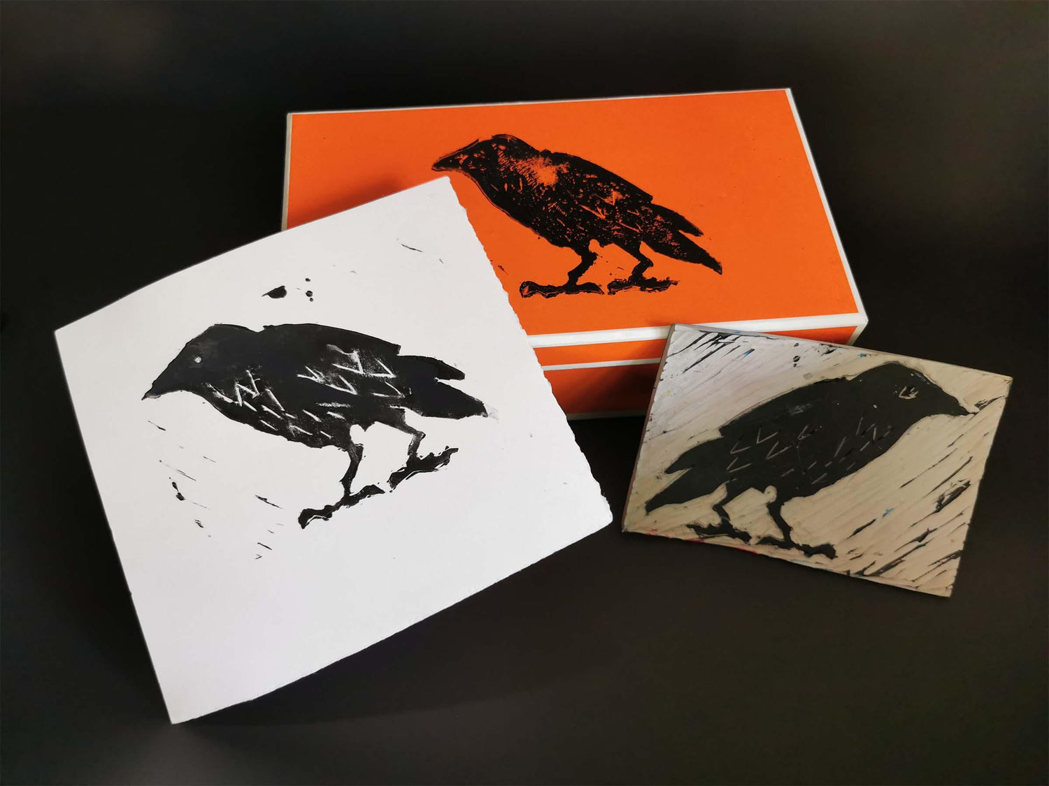 Crow pint on paper and on a orange box