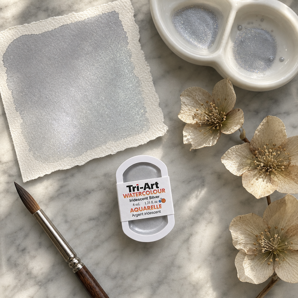 Tri-Art Watercolour pan Iridescent Silver #94979c semi-opaque Series 2 with silver wash swatch on marble flat lay