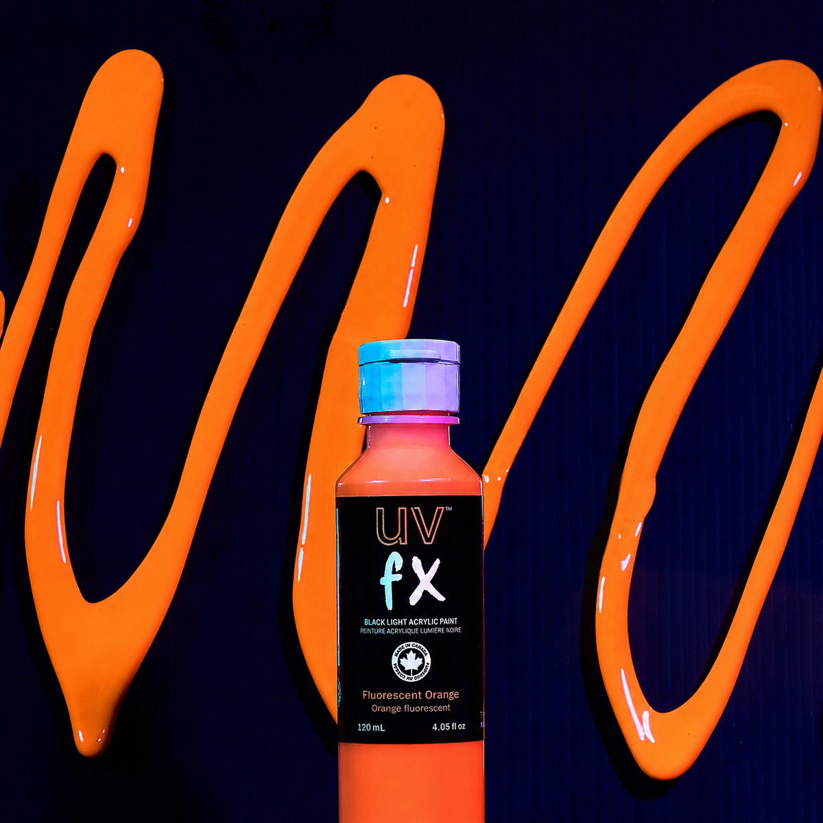 UV FX paint bottle with orange graffiti-style text on a dark background
